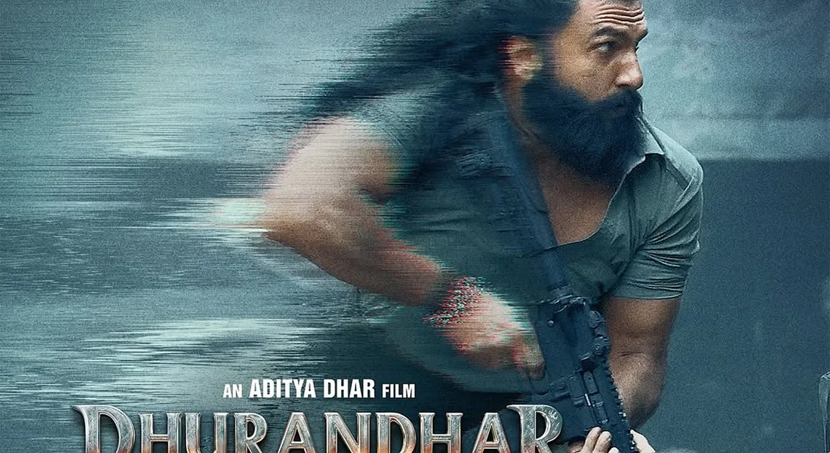 Dhurandhar poster — Ranveer Singh striding through digital static with a rifle, over the film's title