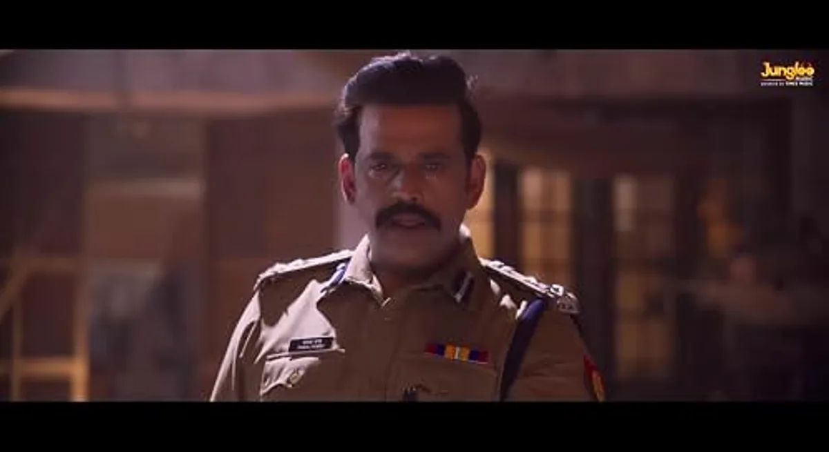Ravi Kishan in khaki police uniform in a dimly lit still from an OTT crime drama