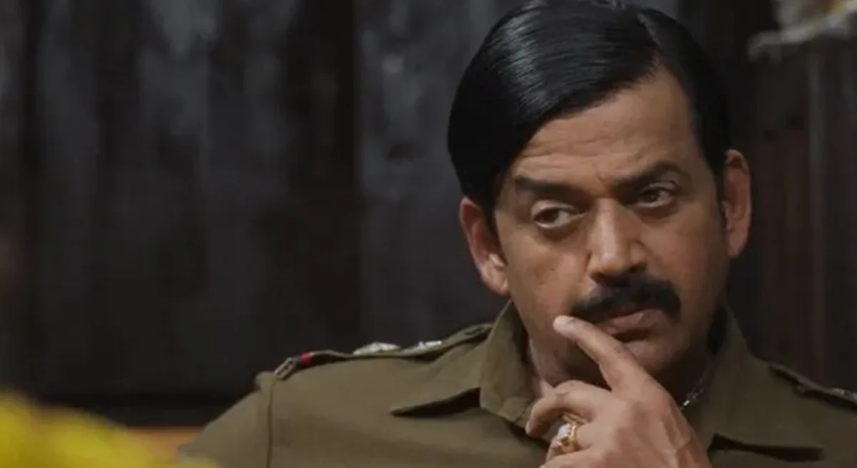 Ravi Kishan speaking at an interview about Laapataa Ladies, dressed in a pale shirt and brown waistcoat
